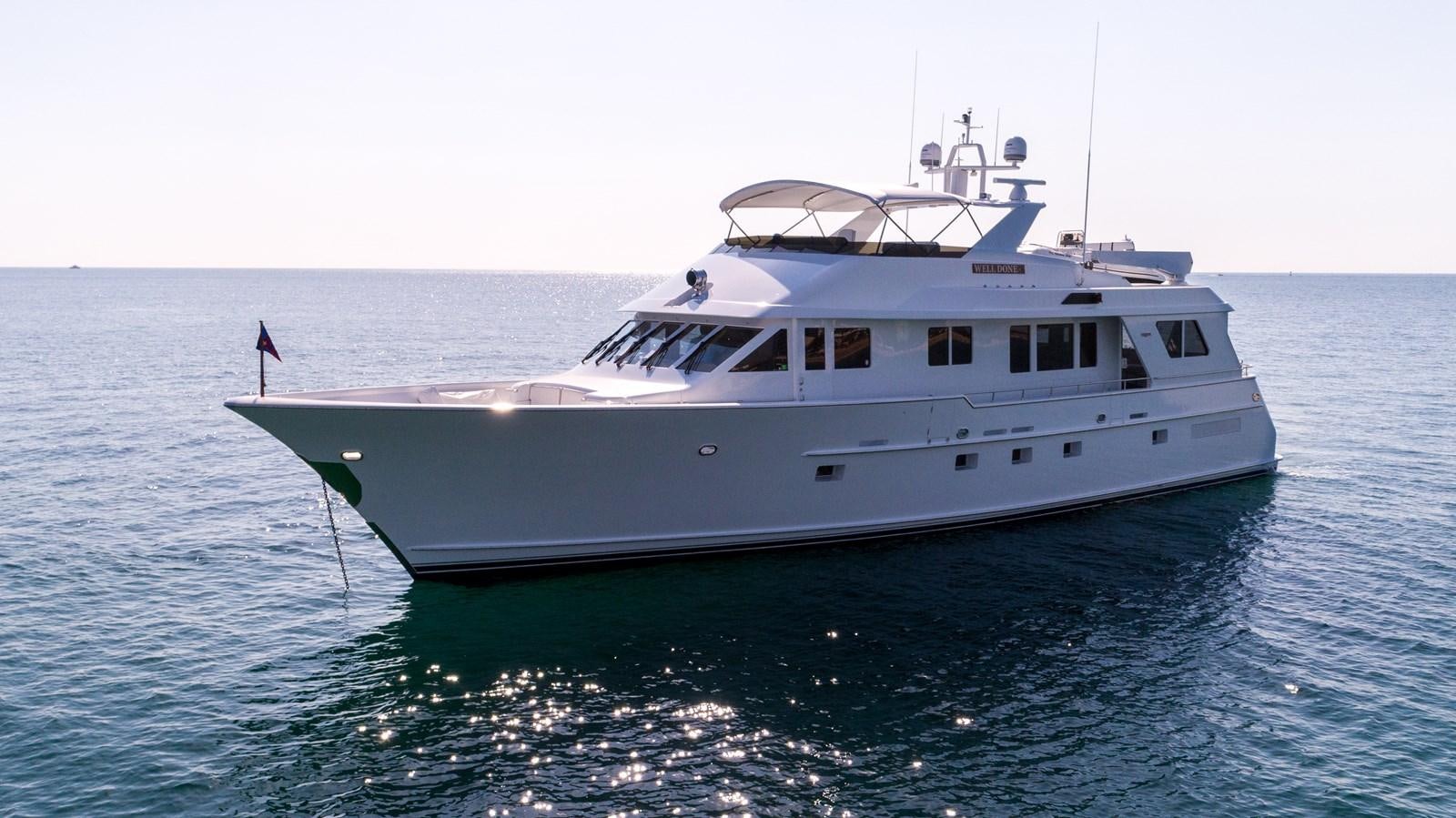 a white boat in the water aboard WELL DONE Yacht for Sale