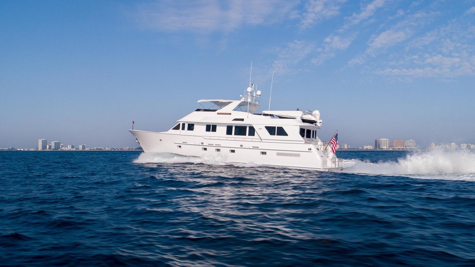a white boat in the water aboard WELL DONE Yacht for Sale