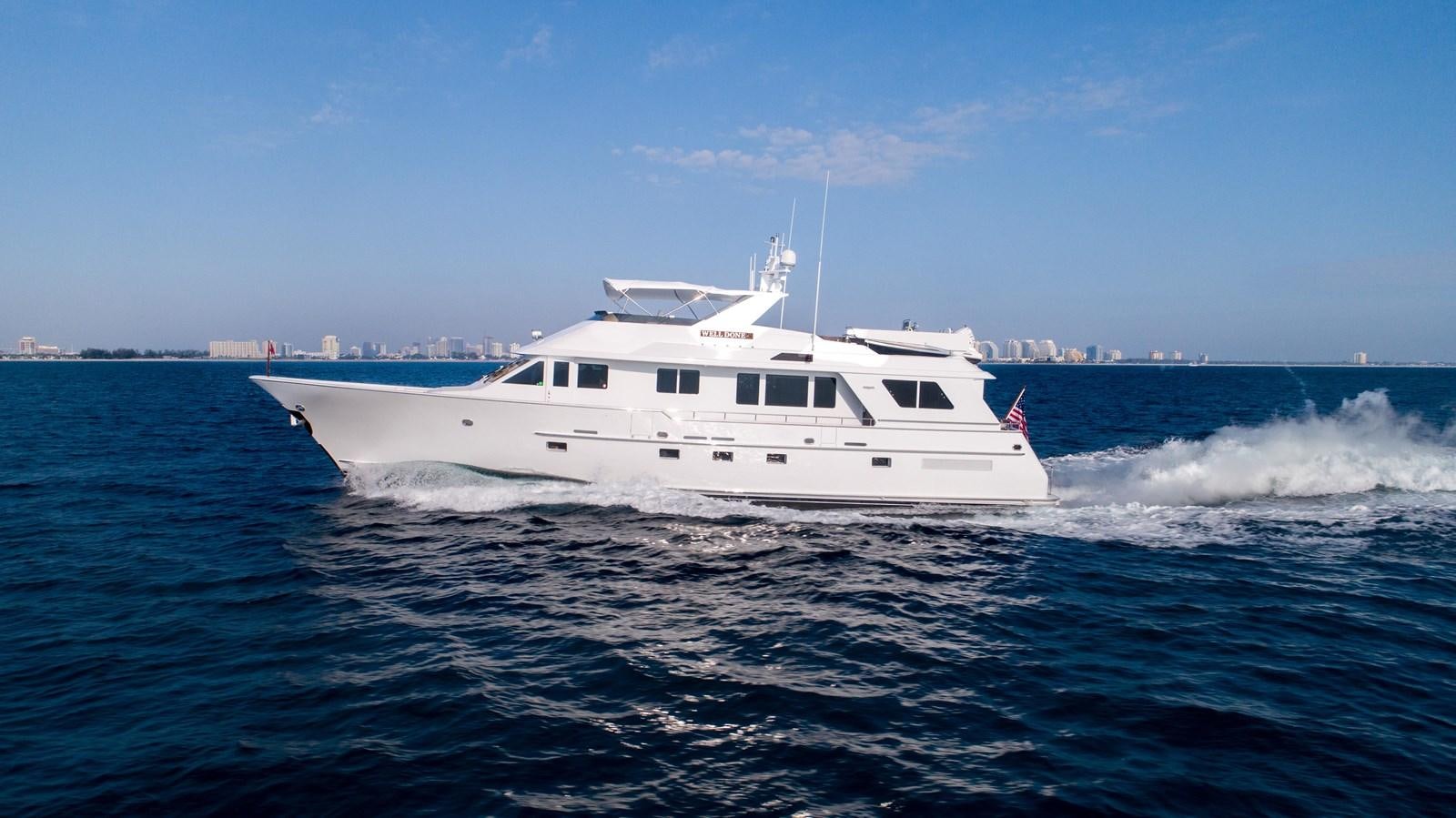 a white boat on the water aboard WELL DONE Yacht for Sale