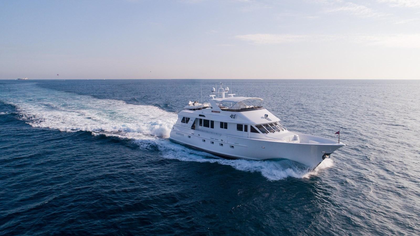 a white boat in the water aboard WELL DONE Yacht for Sale