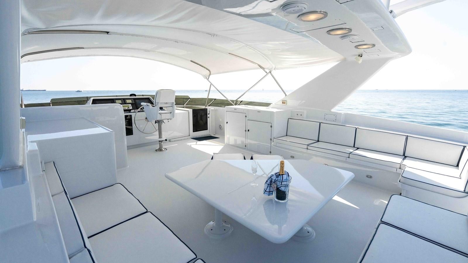 a white table on a boat aboard WELL DONE Yacht for Sale