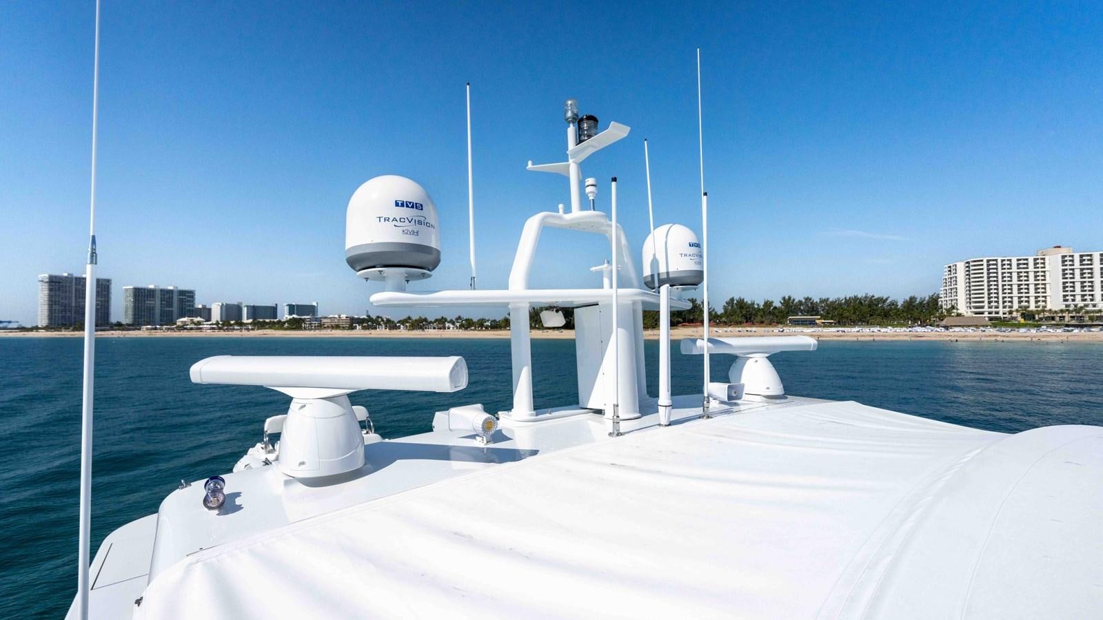 a white satellite dish on a boat aboard WELL DONE Yacht for Sale