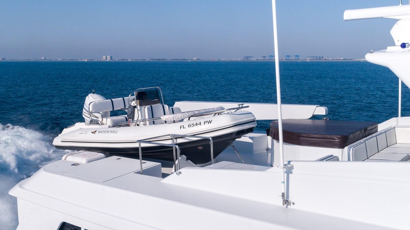 a boat on the water aboard WELL DONE Yacht for Sale
