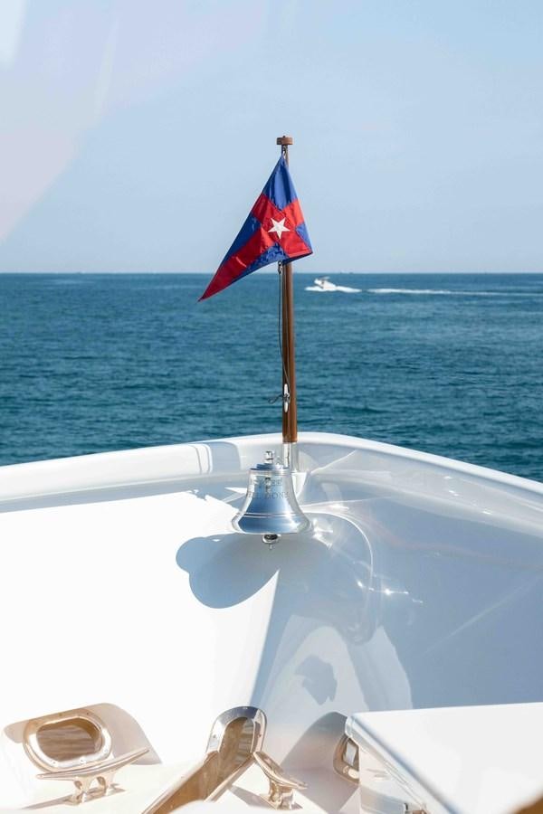 a flag on a boat aboard WELL DONE Yacht for Sale