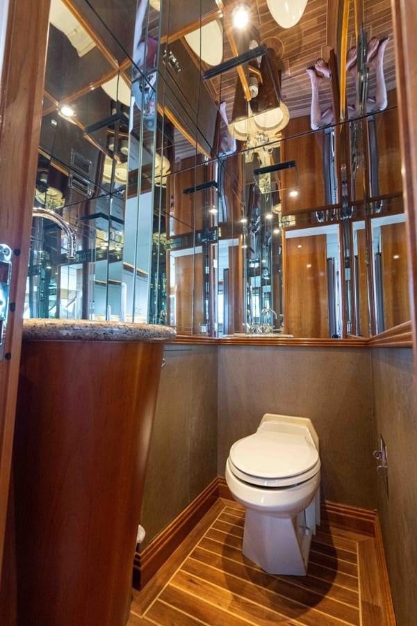a toilet in a bathroom aboard WELL DONE Yacht for Sale