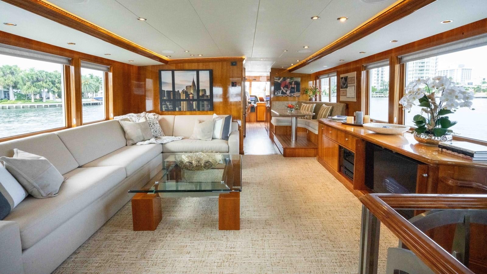 a living room with a couch and a table aboard WELL DONE Yacht for Sale