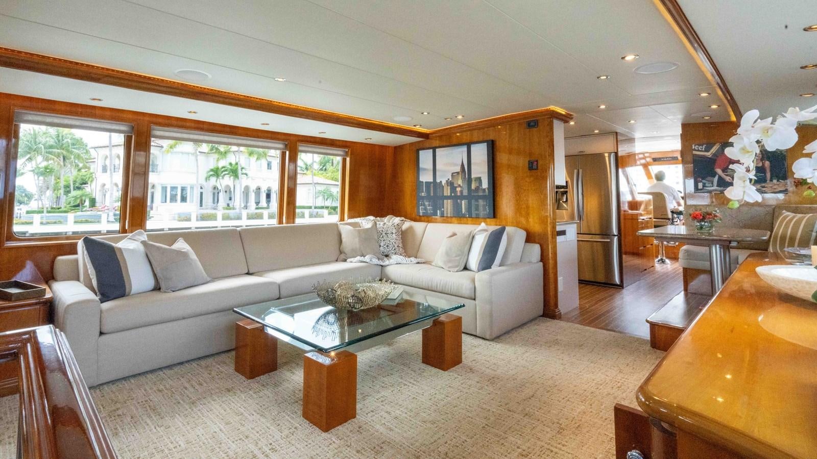 a living room with a couch and a table aboard WELL DONE Yacht for Sale