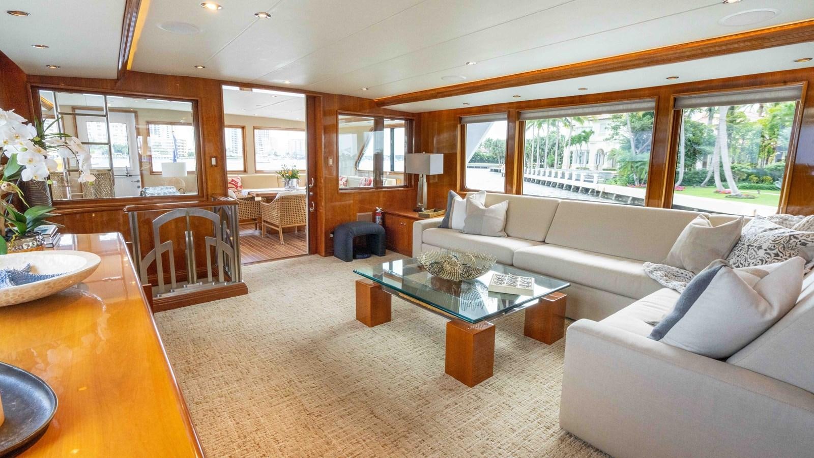 a living room with a large window aboard WELL DONE Yacht for Sale