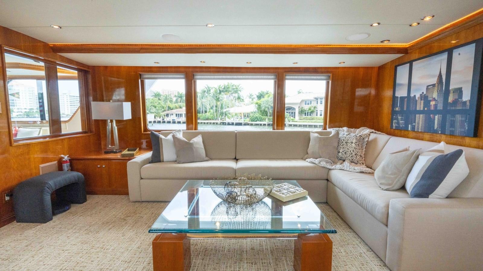 a living room with a large sofa aboard WELL DONE Yacht for Sale