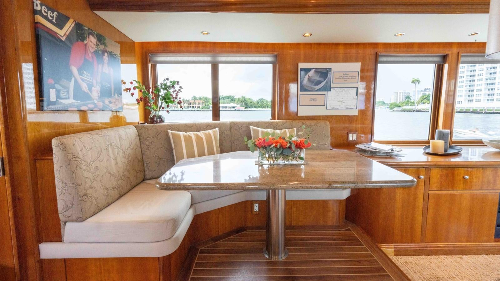 a living room with a couch and a table aboard WELL DONE Yacht for Sale