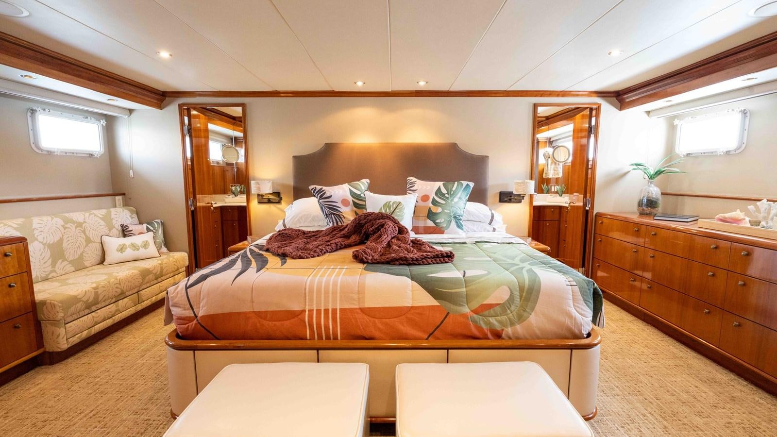 a bed in a room aboard WELL DONE Yacht for Sale