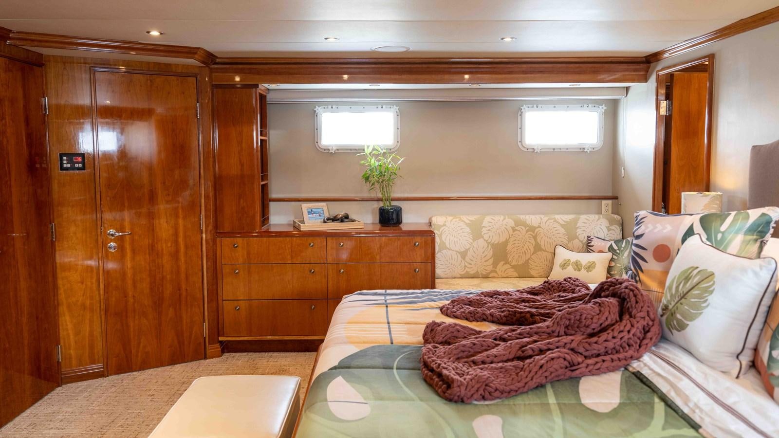 a bed in a room aboard WELL DONE Yacht for Sale