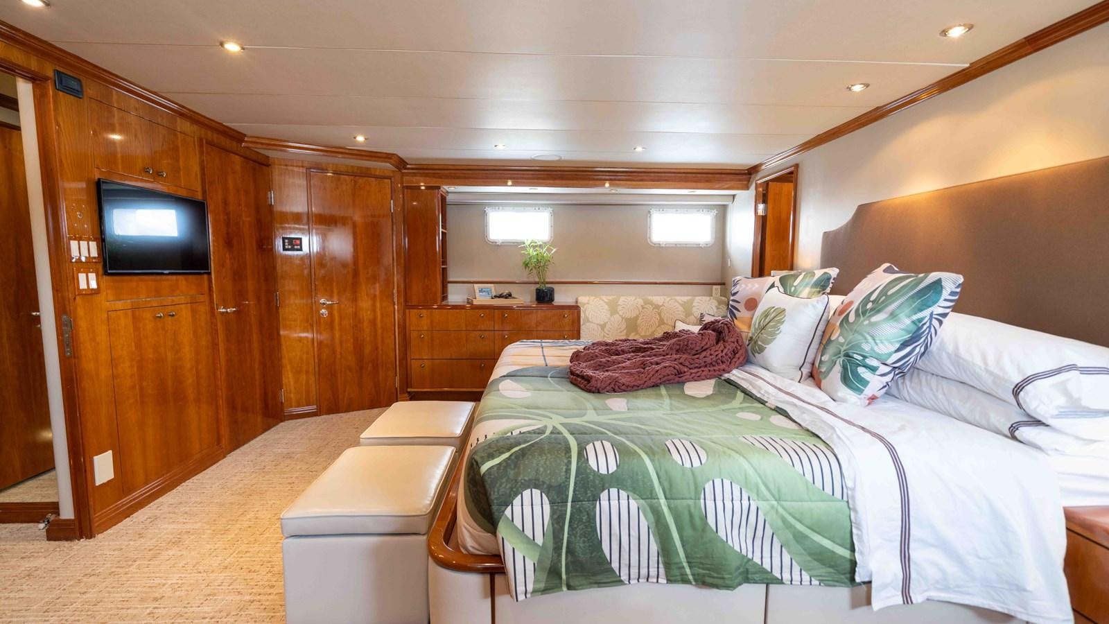 a room with a bed and a tv aboard WELL DONE Yacht for Sale