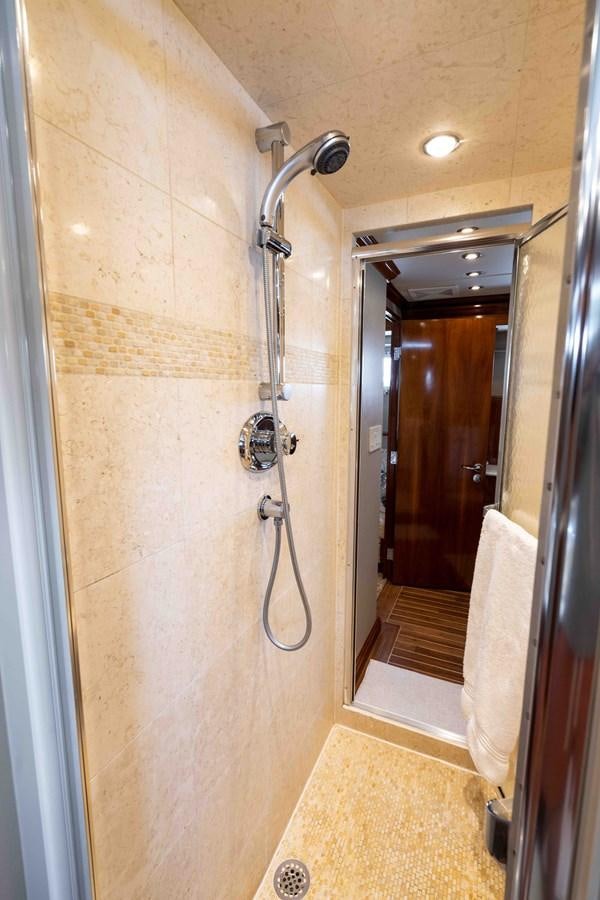 a bathroom with a shower unit aboard WELL DONE Yacht for Sale