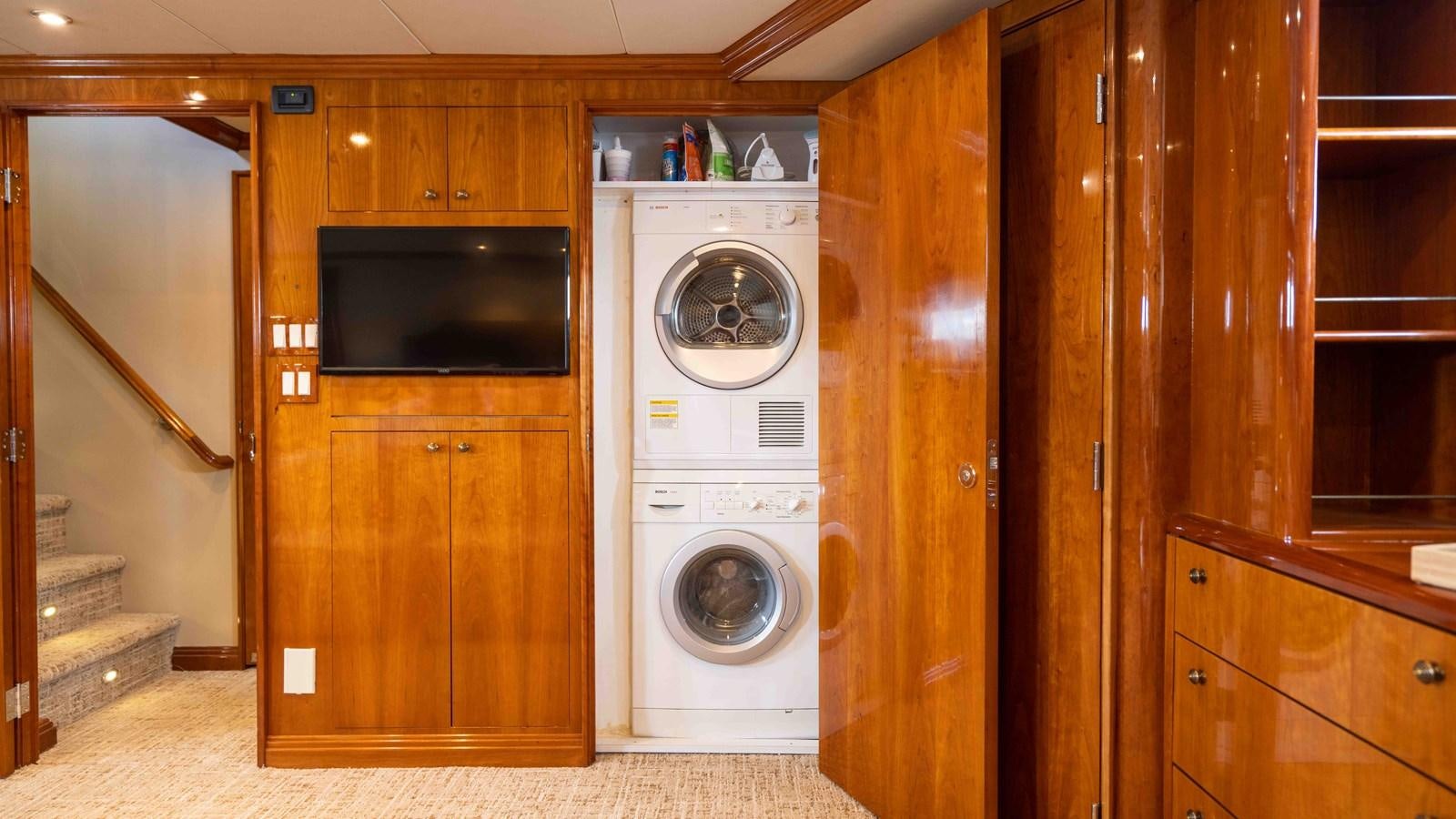 a room with a washer and dryer aboard WELL DONE Yacht for Sale