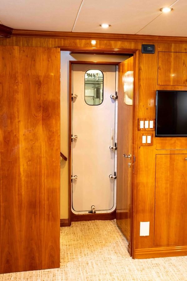 a large elevator with a glass door aboard WELL DONE Yacht for Sale