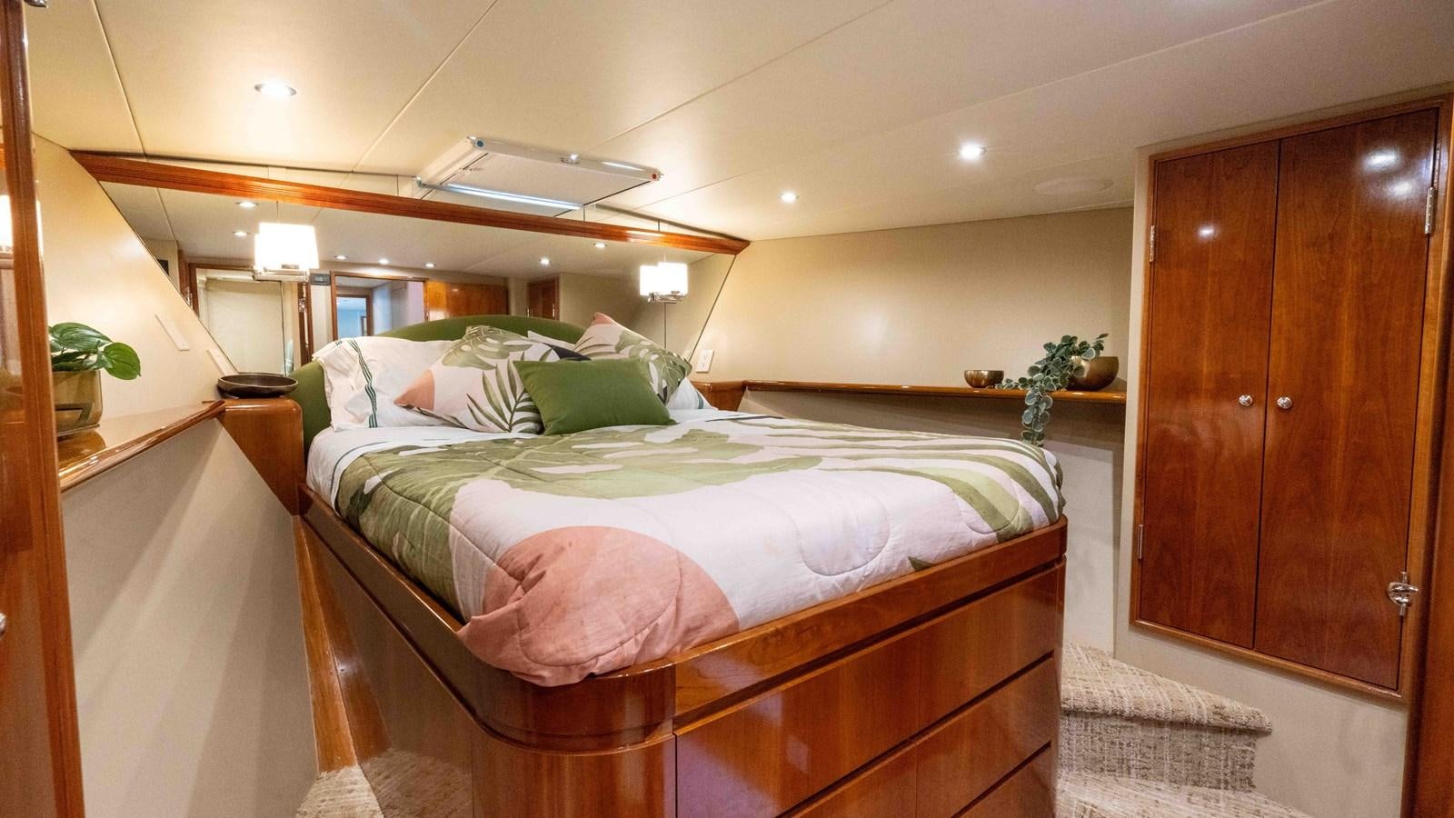 a bed in a room aboard WELL DONE Yacht for Sale