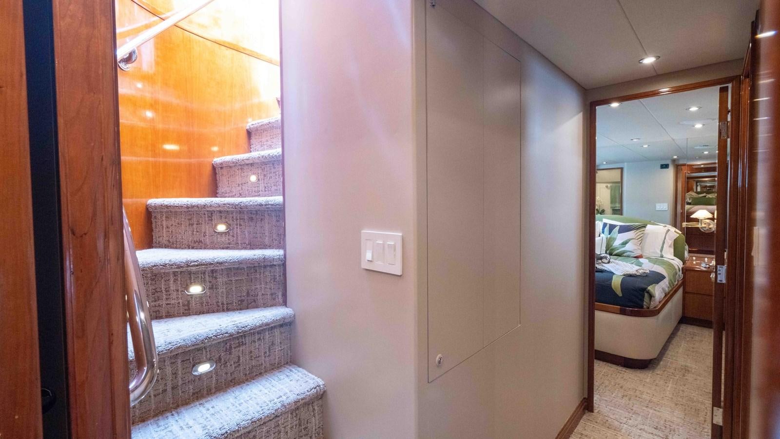 a room with a bed and a mirror aboard WELL DONE Yacht for Sale