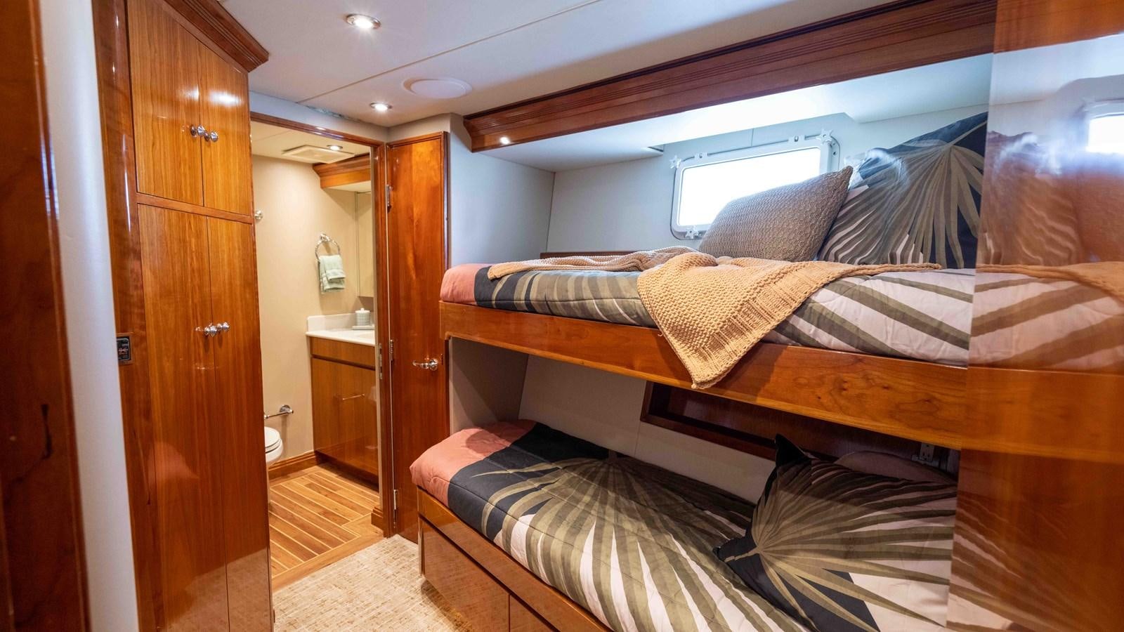 a bed in a room aboard WELL DONE Yacht for Sale