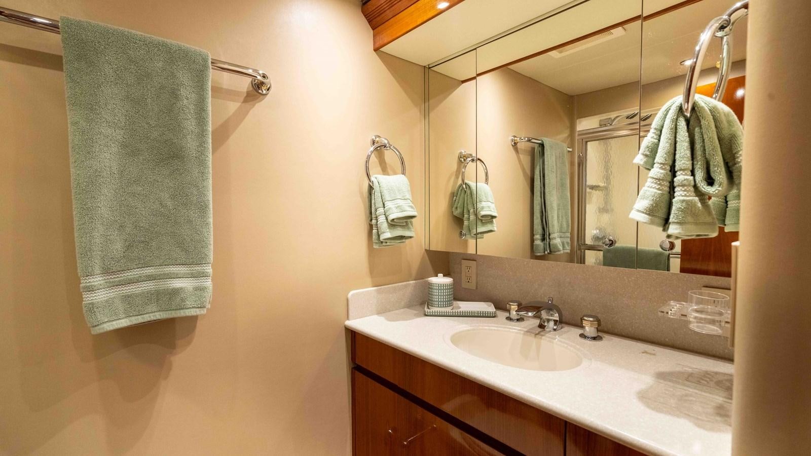 a bathroom with a towel on the wall aboard WELL DONE Yacht for Sale