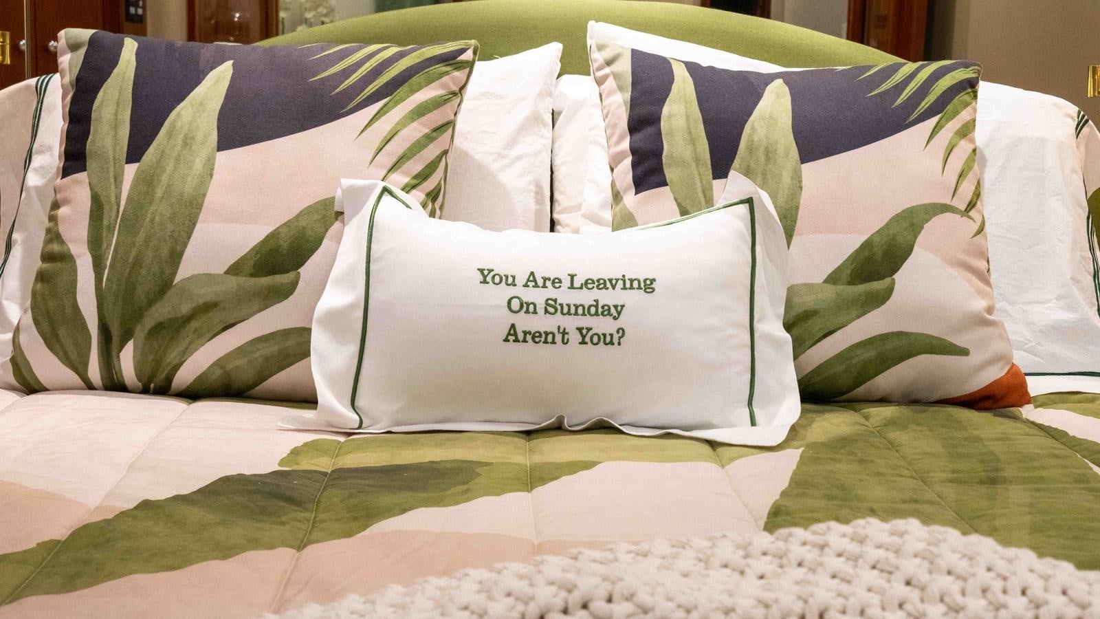 a bed with pillows aboard WELL DONE Yacht for Sale