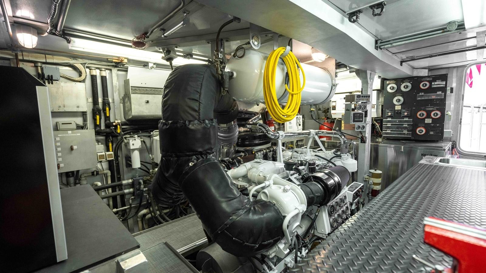 a person working on a car aboard WELL DONE Yacht for Sale