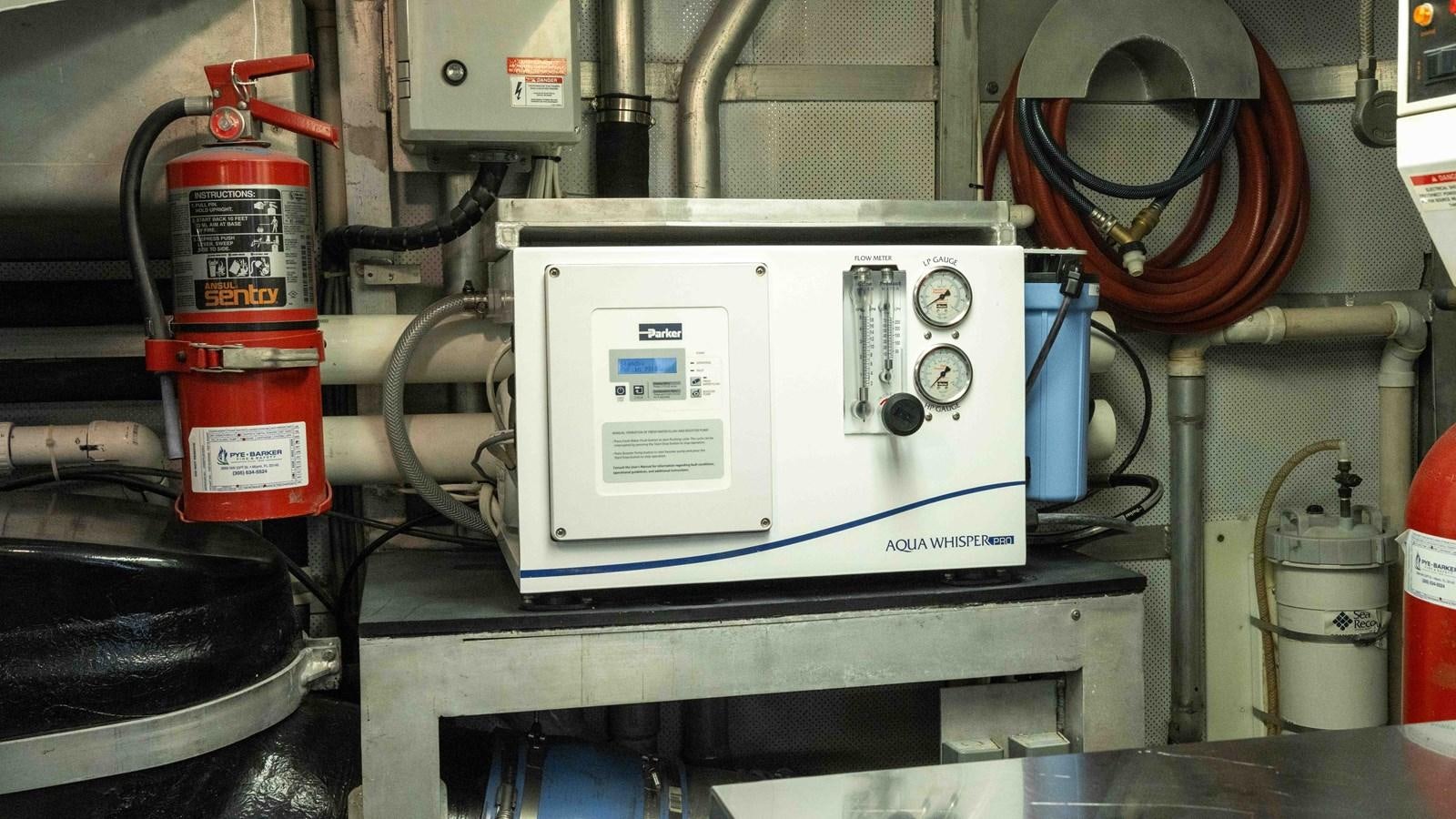 a machine with a red label aboard WELL DONE Yacht for Sale