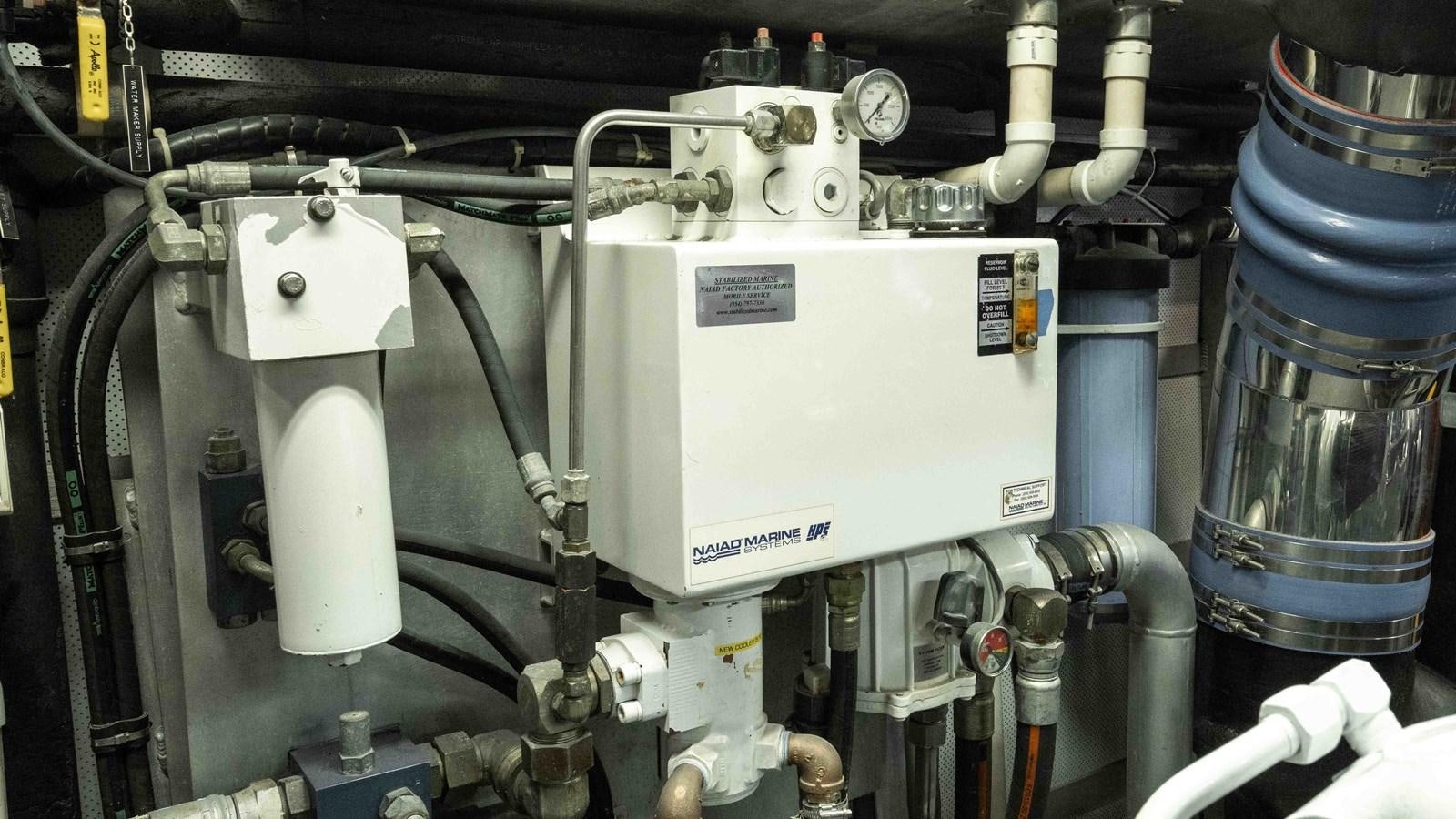 a machine with a large metal cylinder aboard WELL DONE Yacht for Sale