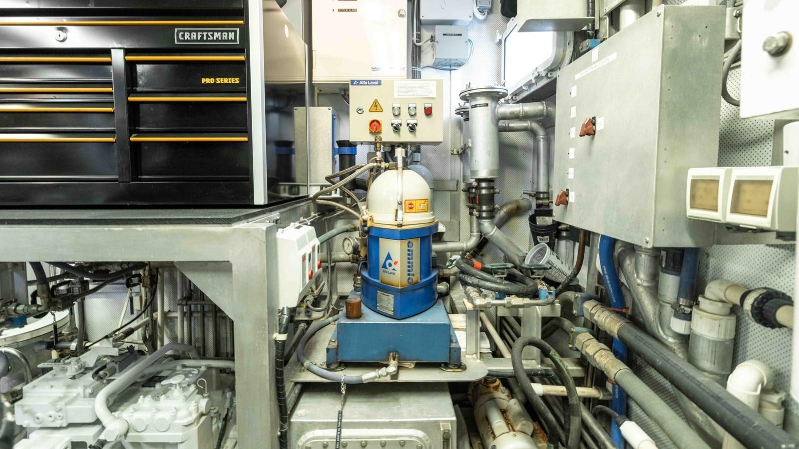 a machine in a room aboard WELL DONE Yacht for Sale