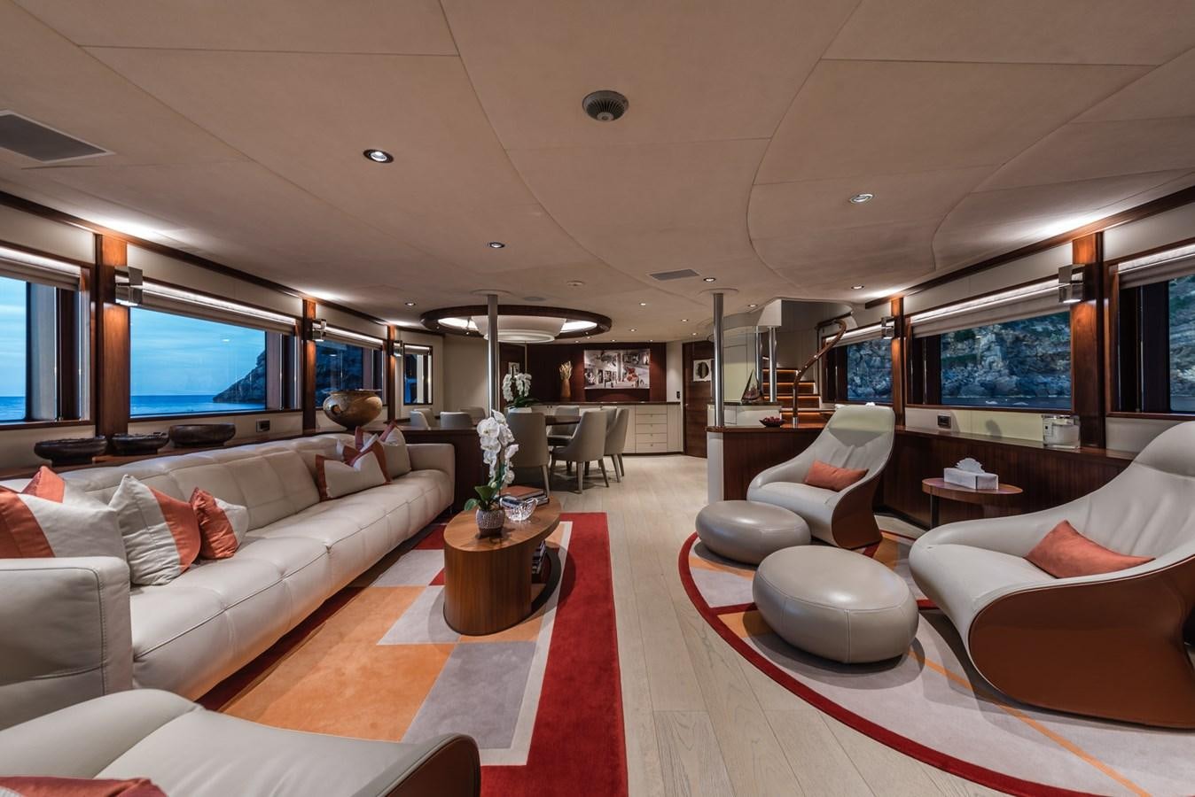 a living room with a large screen aboard FLYING MANTA Yacht for Sale