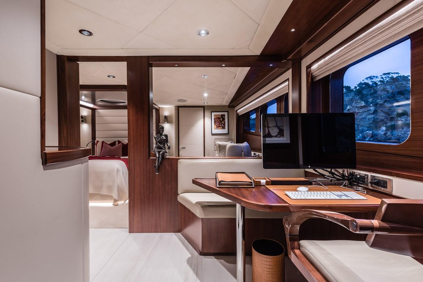 a room with a desk and a computer aboard FLYING MANTA Yacht for Sale