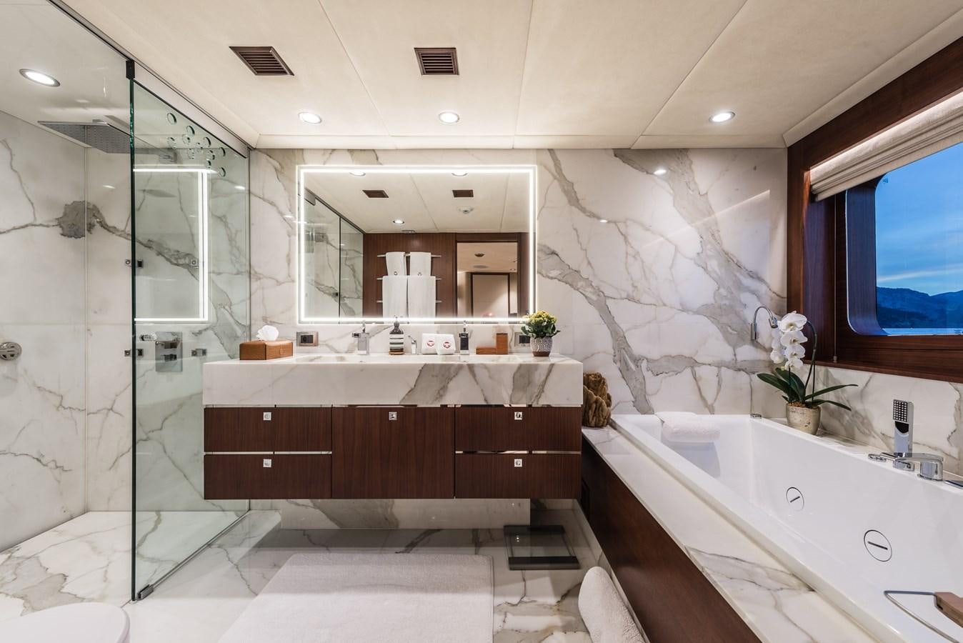 a bathroom with a large bathtub aboard FLYING MANTA Yacht for Sale