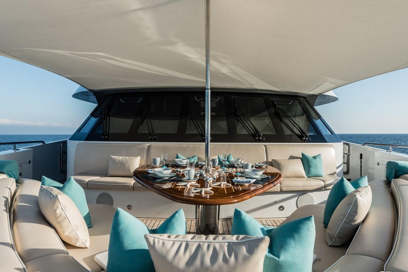 a boat with a table and chairs aboard FLYING MANTA Yacht for Sale