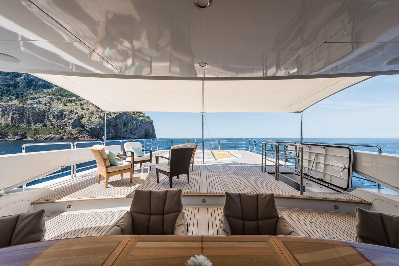 a large balcony overlooking a body of water aboard FLYING MANTA Yacht for Sale