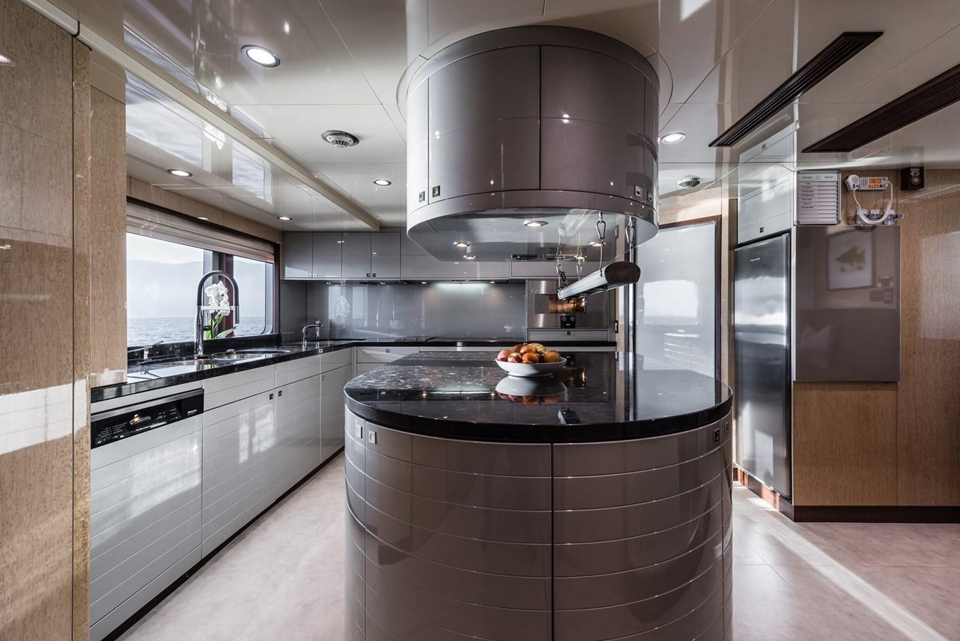 a kitchen with a stove and oven aboard FLYING MANTA Yacht for Sale