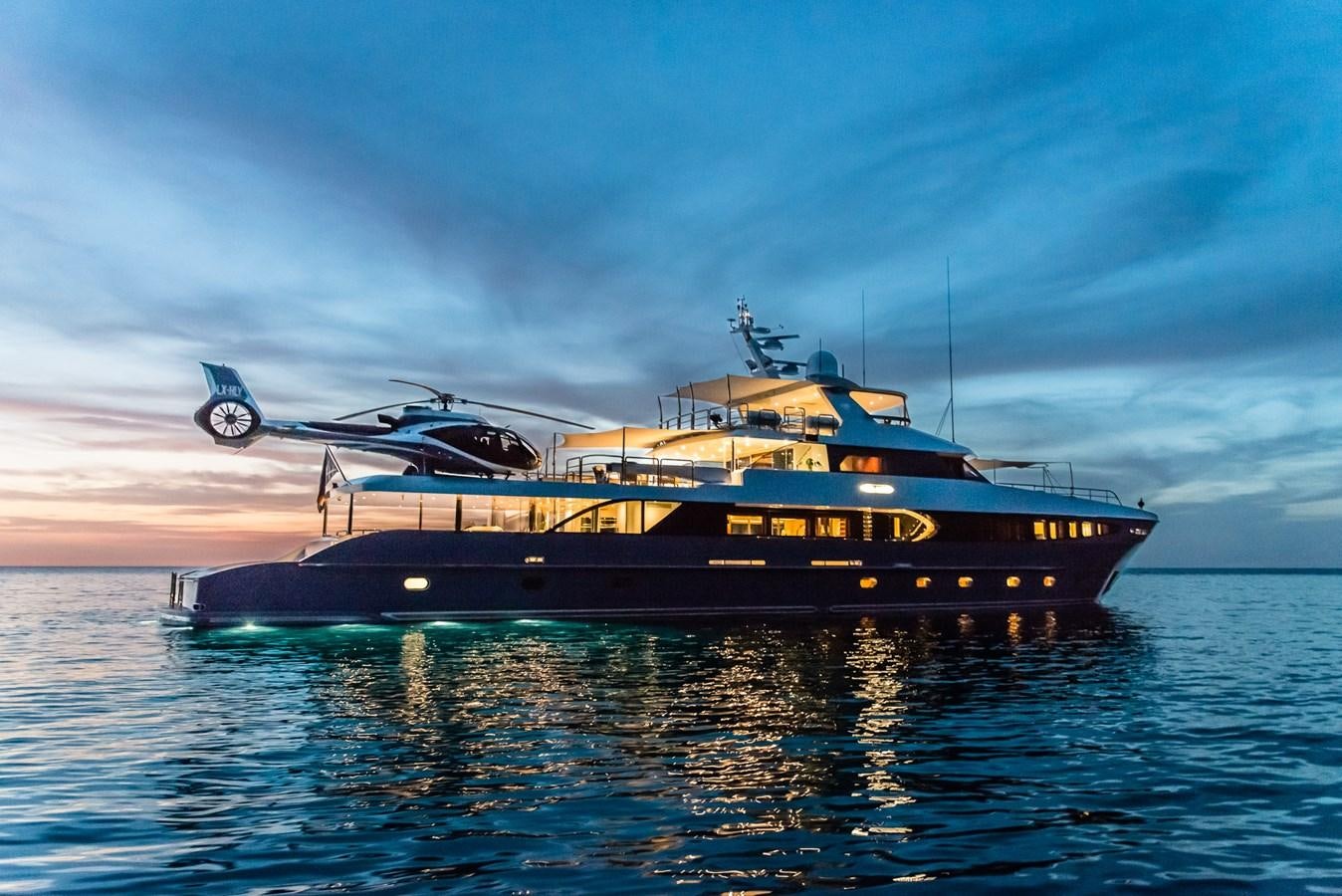 a helicopter flying over a boat aboard FLYING MANTA Yacht for Sale