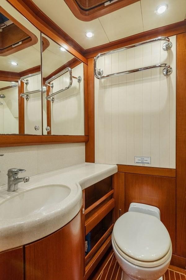 a bathroom with a toilet and sink aboard PAULINE AF SKANOR Yacht for Sale