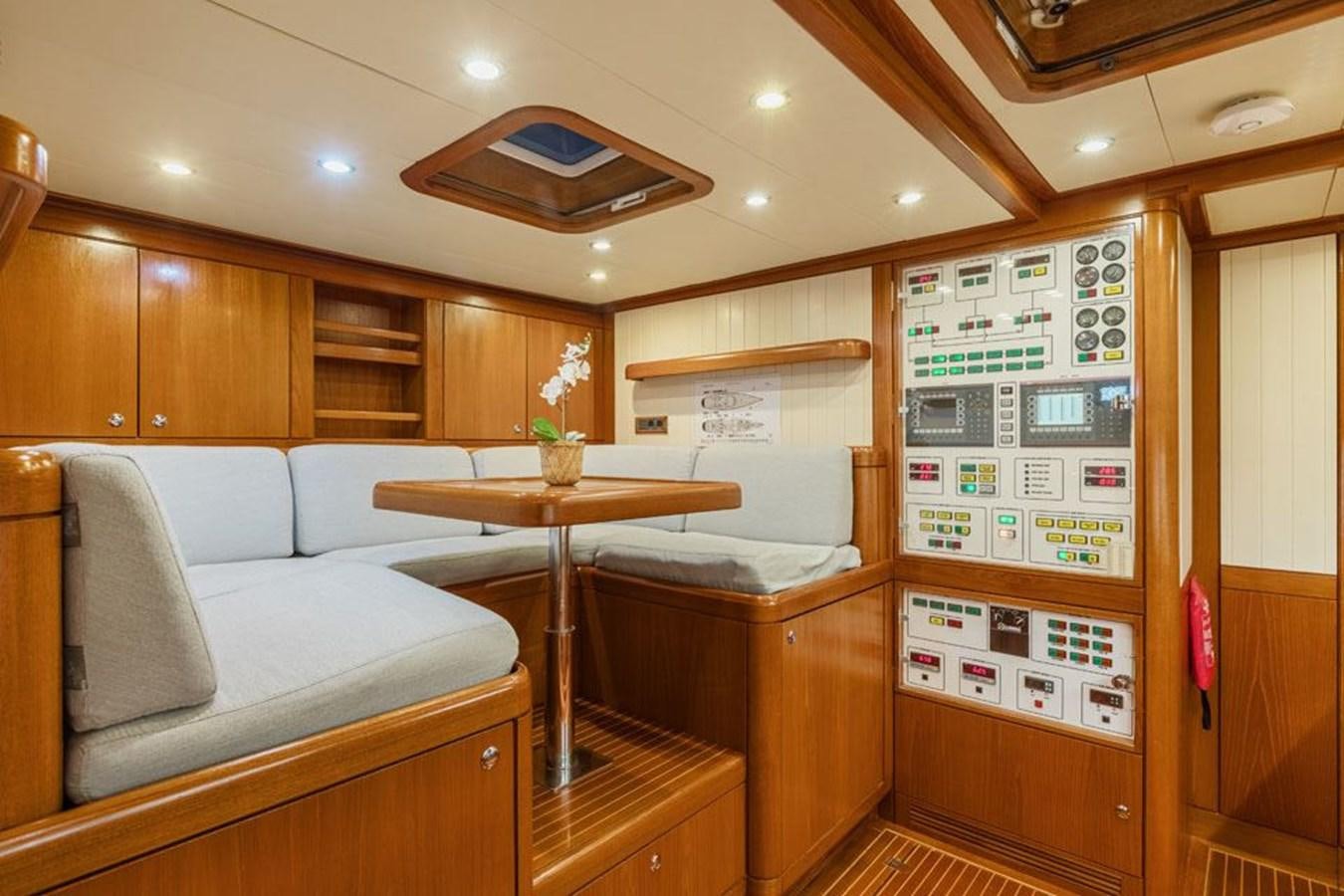 a room with a couch and a table aboard PAULINE AF SKANOR Yacht for Sale