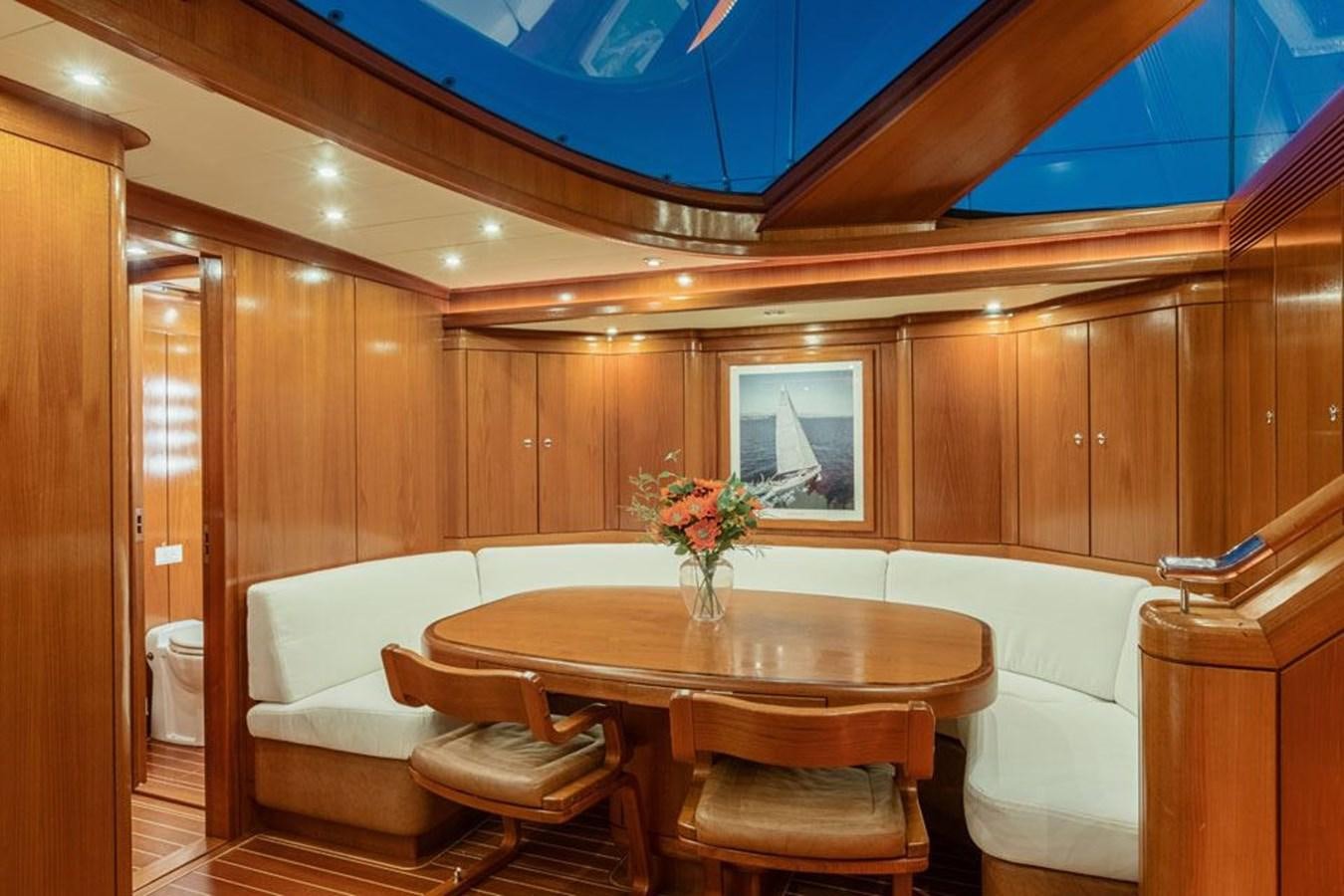 a room with a table and chairs aboard PAULINE AF SKANOR Yacht for Sale