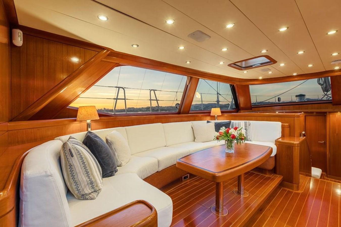 a room with a couch and a table aboard PAULINE AF SKANOR Yacht for Sale
