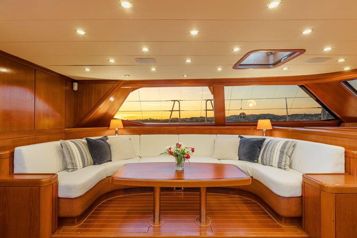 a room with a couch and a table aboard PAULINE AF SKANOR Yacht for Sale