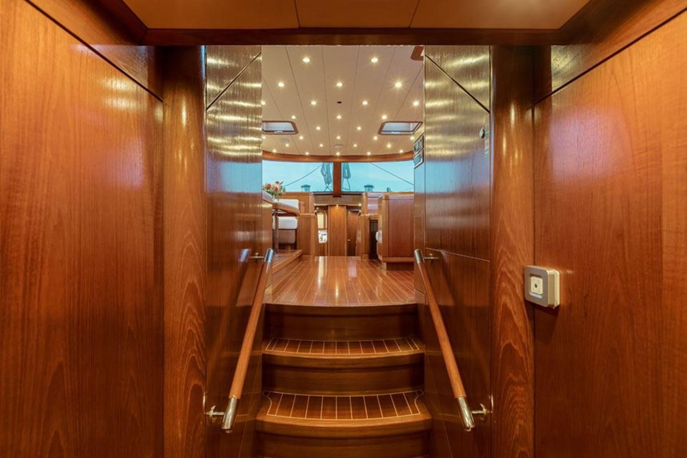 a wooden staircase in a room aboard PAULINE AF SKANOR Yacht for Sale