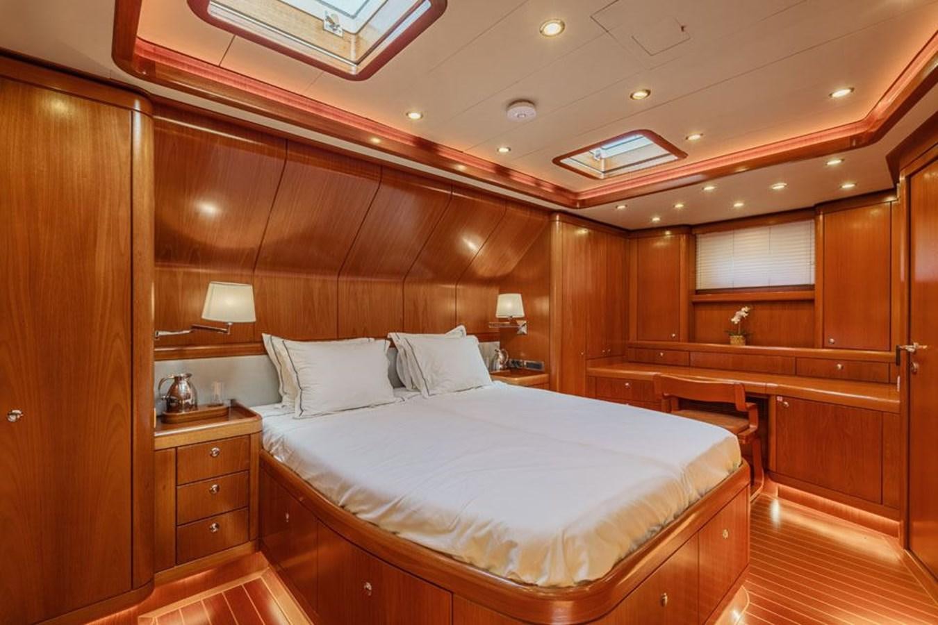 a bed with white sheets aboard PAULINE AF SKANOR Yacht for Sale