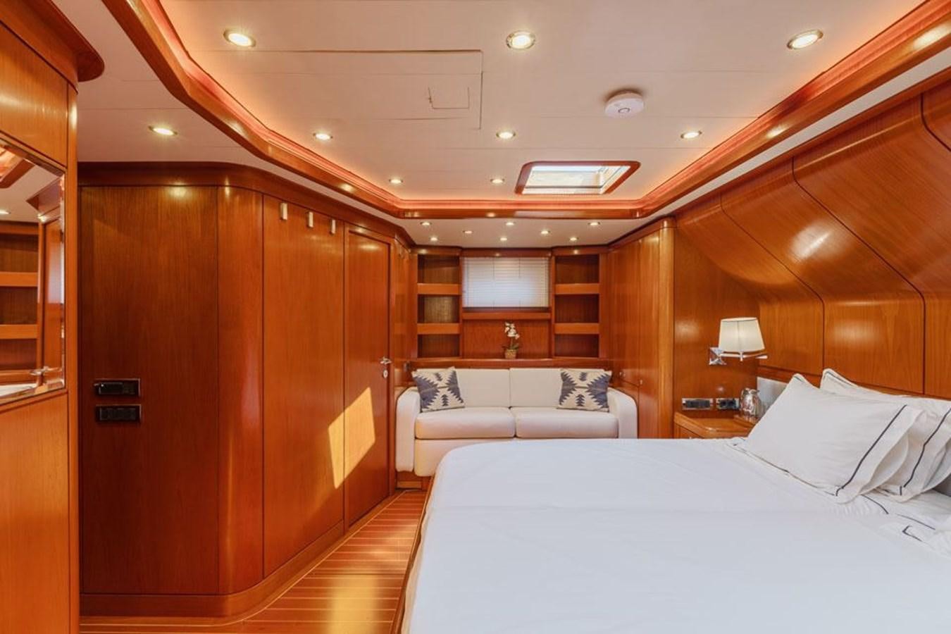 a room with a bed and a couch aboard PAULINE AF SKANOR Yacht for Sale