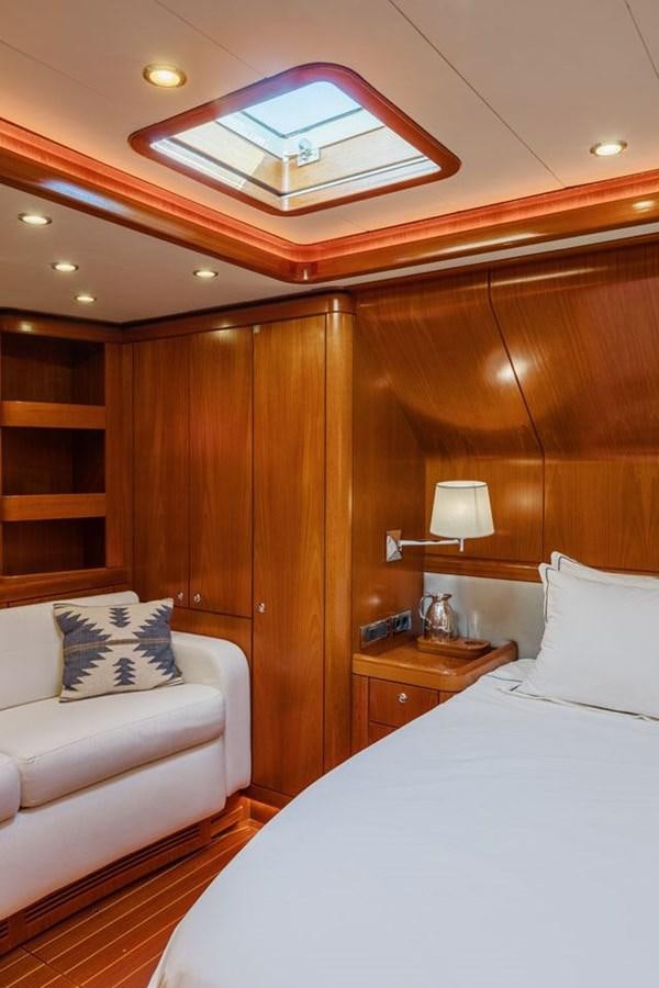 a room with a bed and a television aboard PAULINE AF SKANOR Yacht for Sale