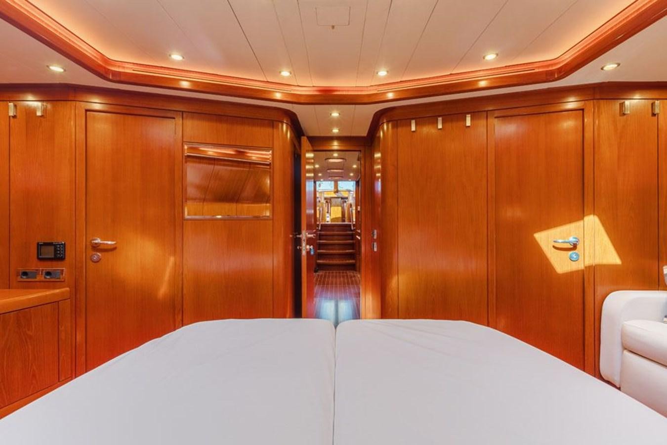 a room with a bed and a closet aboard PAULINE AF SKANOR Yacht for Sale