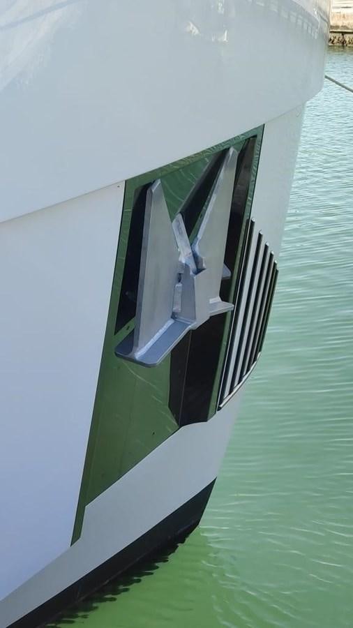 a black and white boat aboard KIKI Yacht for Sale