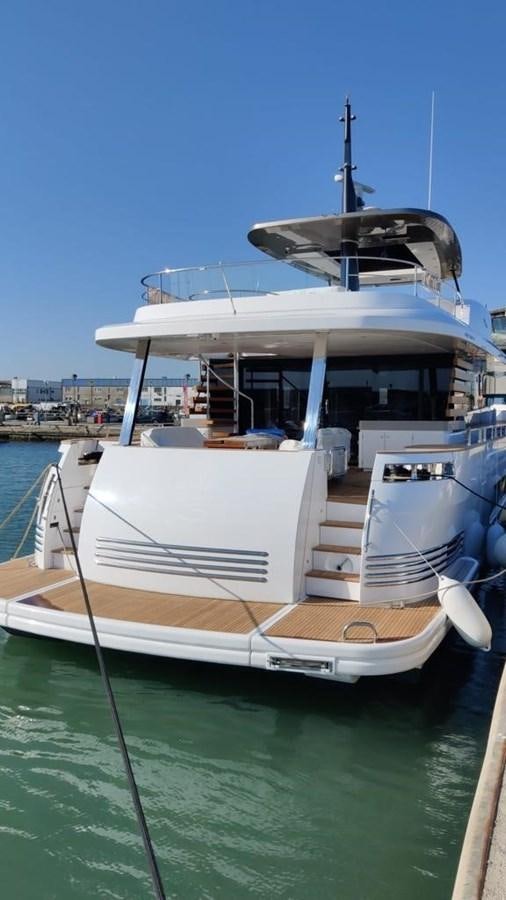 a boat docked at a pier aboard KIKI Yacht for Sale
