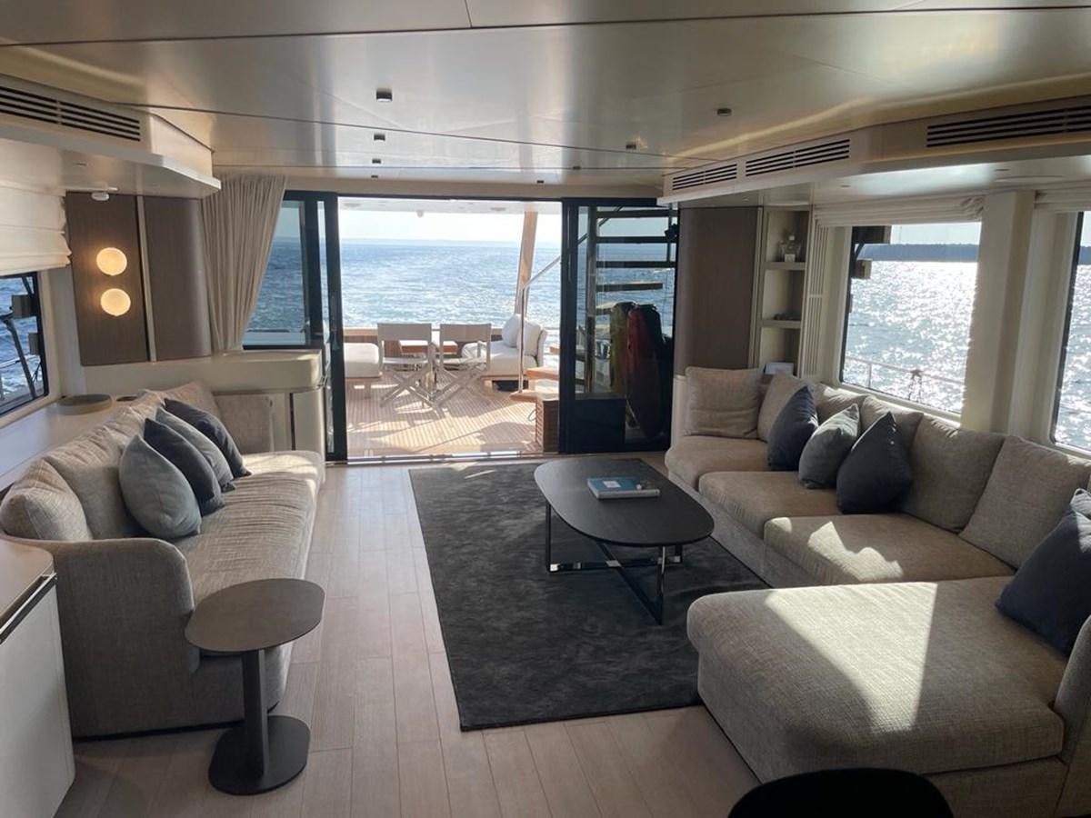 a living room with a large window aboard KIKI Yacht for Sale