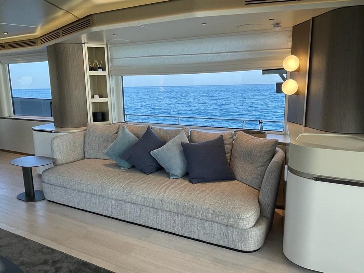 a couch in a room aboard KIKI Yacht for Sale